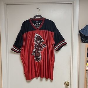 THIS IS A VINTAGE RED JNCO SPORTS JERSEY. IT'S AN XL MADE OF 1OO%POLYESTER. I